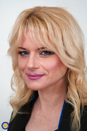 Blonde businesswoman with pretty face is waiting for partner