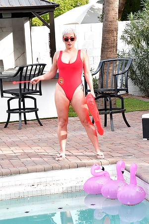 Tattooed blonde lifeguard strips and rides dick poolside