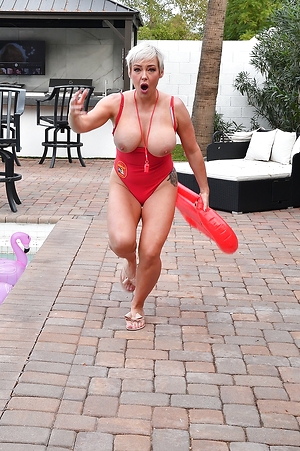 Tattooed blonde lifeguard strips and rides dick poolside